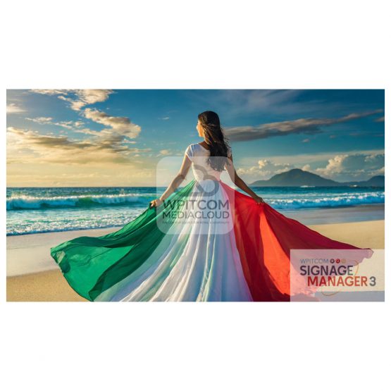 A lady on the beach wearing a skirt of italian / mexican flag