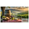 Romantic vineyard with table with red wine and bread