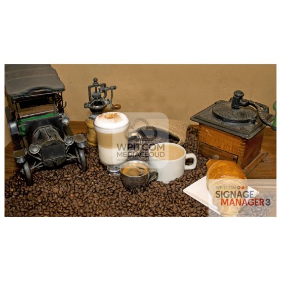 A cup of capuccino on a table with beans and croissant