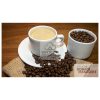 A cup of black coffee crema on a table with beans