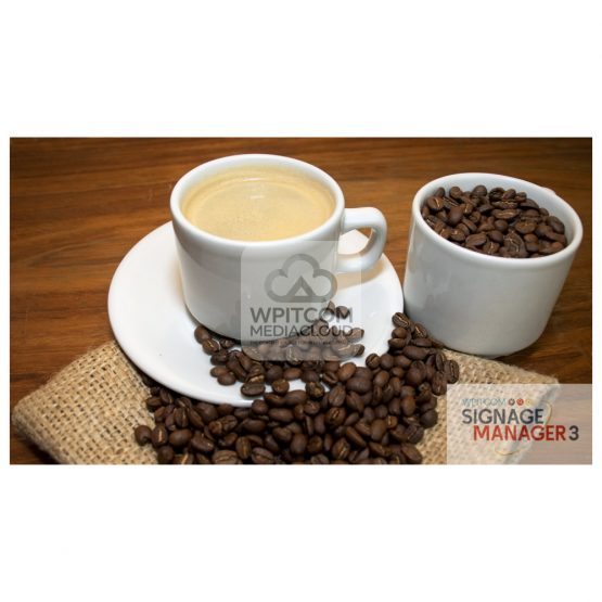 A cup of black coffee crema on a table with beans