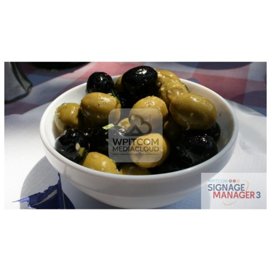 Background with a bowl of green and black olives